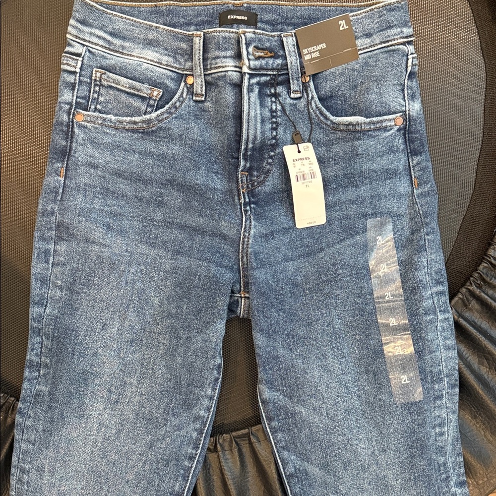 Express Women's Indigo Mid-Rise skyscraper Jeans with inner split hem